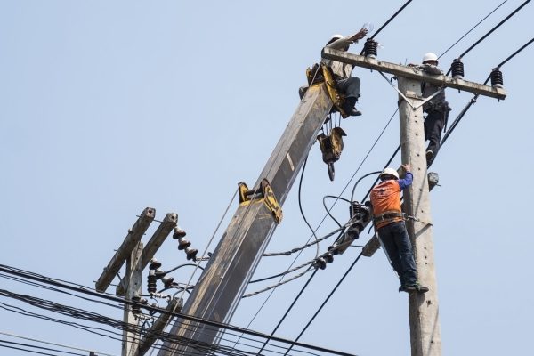 selective-focus-electricians-are-fixing-power-transmission-line-electricity-pole